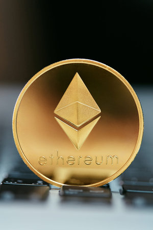 Cryptocurrency. Ethereum Coin On Computer Close Up. Digital Currency Symbol. High Resolution