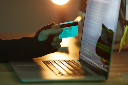 Credit Card Hacking. Stealing Money Online. Hacker Using Personal Information And Technology's For Crime Online. High Resolutionの写真素材
