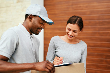 Courier Delivery Service. Man Delivering Package To Woman