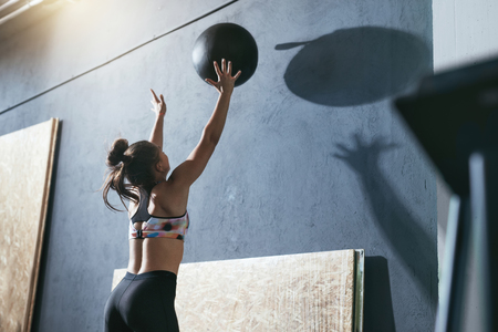 Workout. Sport Woman Training With Crossfit Ball At Gymの写真素材