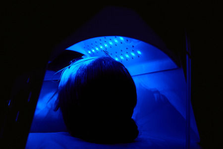 Cosmetology. Woman Face Getting Blue Light Oxygen Treatment At Beauty Clinic. Facial Photo Therapy. High Resolutionの写真素材