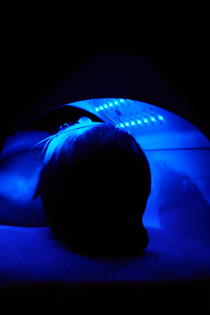 Cosmetology. Woman Face Getting Blue Light Oxygen Treatment At Beauty Clinic. Facial Photo Therapy. High Resolutionの写真素材