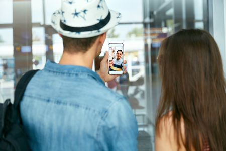 Video Call On Phone. Close Up Hand With Phone And Face On Screen. People Calling Friend With Video Chat. High Resolutionの写真素材