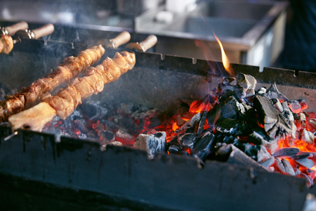 Grilling Meat On Skewers. Barbecue Meat Pieces Cooking On Grill In Restaurant. High Resolutionの写真素材