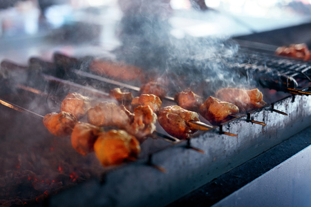 Grilling Meat On Skewers. Barbecue Meat Pieces Cooking On Grill In Restaurant. High Resolutionの写真素材