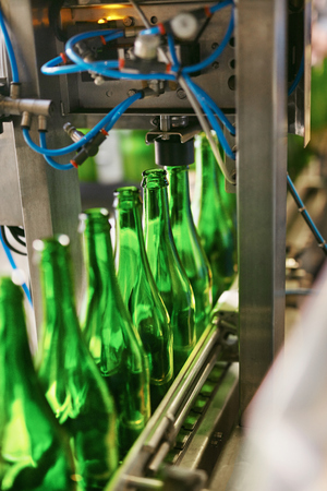 Beer Brewing Process On Brewery. Glass Bottles For Craft Beer On Conveyor. High Resolutionの写真素材