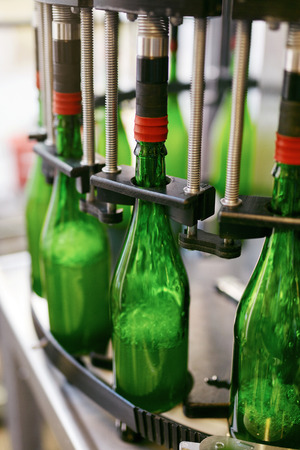 Beer Brewery. Craft Beer Manufacturing Process. Bottling Beer On Conveyor Line. High Resolutionの写真素材