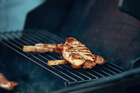 Barbecue. Meat Steak On Grill Closeup. Grilling Pieces Of Meat. High Resolutionの写真素材
