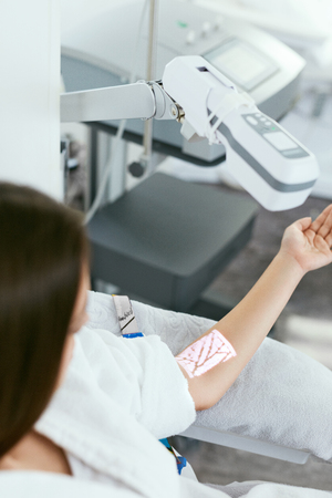 Medical Procedure. Woman Scanning Veins With Vein Finder, Vein Mapping On Hand. High Resolutionの写真素材