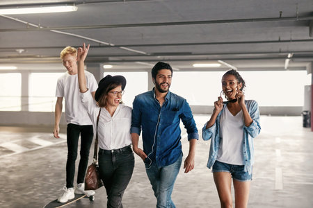 Attractive Young People In Casual Fashionable Clothes At Mall Parking, Stylish Friends Indoors. High...