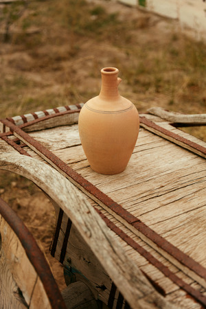 Clay Pitcher On Wooden Cartload Outdoors, Pottery On Rural Cart. High Resolutionの写真素材