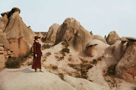 Woman Traveling, Exploring Nature Of Rocks Valley. Female Traveler Travel At Desert Canyon. High Resolutionの写真素材