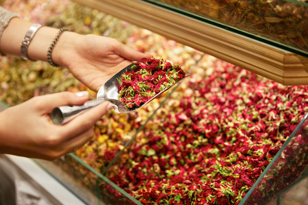 Natural Flower Tea. Hands Taking Tea From Showcase At Shop. High Resolutionの写真素材