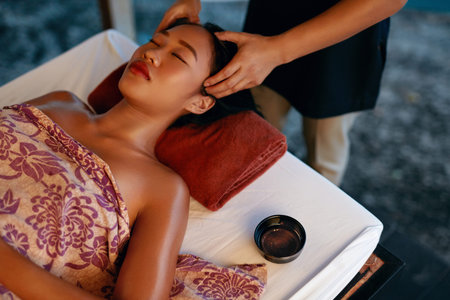 Spa Massage. Hands Massaging Woman Head At Thai Beauty Salon. Asian Girl Enjoying Massage Therapy....