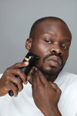 Shaving. Male Facial Hair Removing. Skincare Beauty Routine. Using Of Electric Razor Shaver Tool For Beard.の写真素材