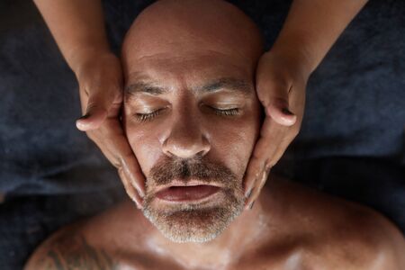 Spa Face Massage. Skin Care Beauty Treatment. Relaxed Man On Natural Cosmetic Facial Procedure. Rejuvenation Therapy.の写真素材