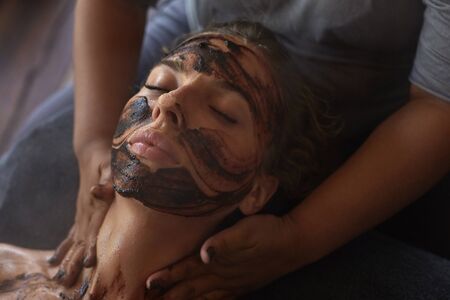 Spa Face Mask. Beauty Treatment For Skin Care. Beautician Massaging Female Face. Relaxed Model On Natural Cosmetics Procedure.の写真素材