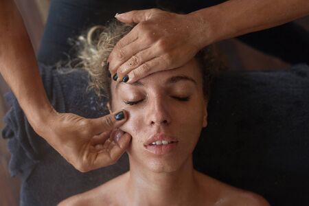Spa Face Massage. Skin Care Beauty Treatment For Woman. Beautician Massaging Female Face. Relaxed Model On Natural Cosmetics Procedure.の写真素材