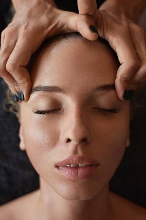 Spa Face Massage. Skin Care Beauty Treatment For Woman. Beautician Massaging Female Face. Relaxed Model On Natural Cosmetics Procedure.の写真素材