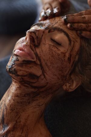 Spa Face Mask. Beauty Treatment For Skin Care. Beautician Massaging Female Face. Relaxed Model On Natural Cosmetics Procedure.の写真素材