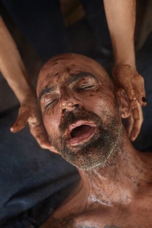Spa Massage. Skin Care Beauty Treatment For Male. Beautician Massaging Man With Mud. Relaxed Model On Natural Cosmetics Procedure.の写真素材