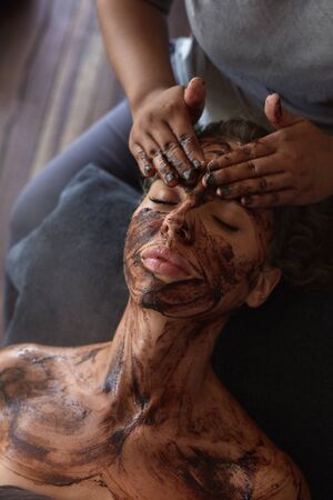 Spa Face Mask. Beauty Treatment For Skin Care. Beautician Massaging Female Face. Relaxed Model On Natural Cosmetics Procedure.の写真素材
