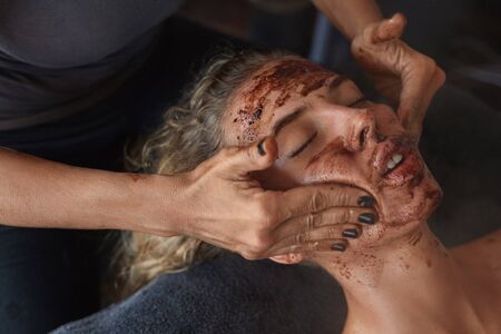 Spa Face Mask. Beauty Treatment For Skin Care. Beautician Massaging Female Face. Relaxed Model On Natural Cosmetics Procedure.の写真素材