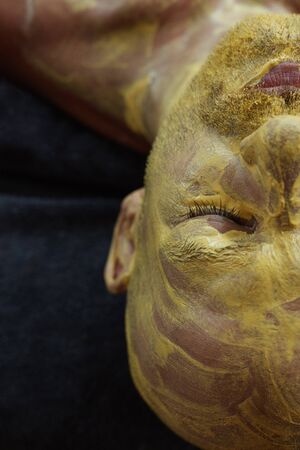 Spa Face Mask. Skin Care Beauty Treatment. Relaxed Man On Natural Cosmetic Mud Facial Procedure.の写真素材