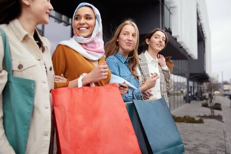 Shopping. Diversity Girls Holding Bags. Group Of Smiling Multicultural Women Standing Near Mall. International Friendship And Urban Lifestyle.の写真素材