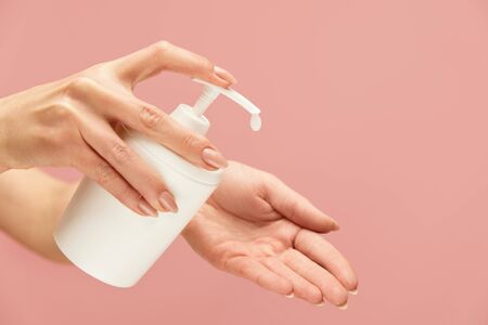 Hand Hygiene. Liquid Soap Bottle In Female Hand To Stop Spreading Of Coronavirus. Daily Personal Hygiene Routine For Virus Prevention. Wash Your Hands For Staying Healthy.の写真素材