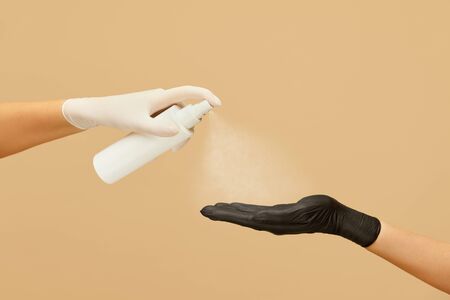 Hygiene. Hands In Gloves Using Spray Antiseptic To Stop Coronavirus Spreading. Daily Routine With Antibacterial Products For Virus Prevention And Staying Healthy.の写真素材