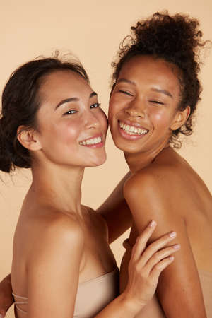 Beauty. Smiling women with perfect face skin and makeup portraitの写真素材