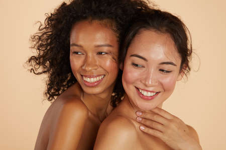 Beauty. Smiling women with perfect face skin and makeup portraitの写真素材