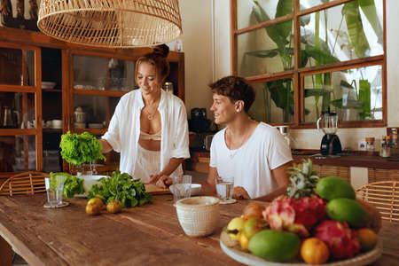 Healthy Diet. Couple Cooking Vegetable Salad At Kitchen In Tropical Villa. Cheerful Woman And Handsome Man Preparing Fresh Organic Food For Lunch. Natural Vitamins For Nutrition On Summer Vacation.の写真素材