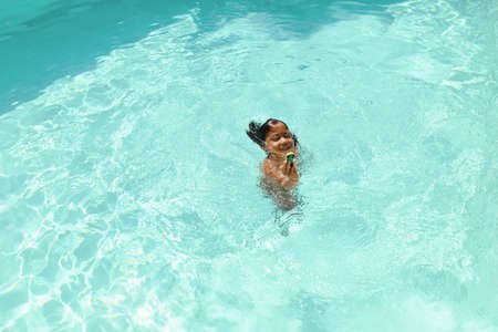 Boy In Swimming Pool. Summer Entertainment For Fun In Turquoise Water At Resort. Happy Wet Kid Enjoying Leisure On Vacation. Summer Activity As Lifestyle.の写真素材