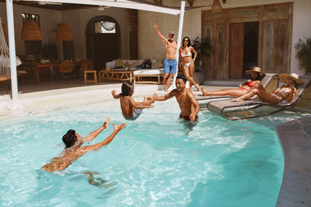 Summer Entertainment At Pool. Group Of People Having Fun On Family Vacation At Tropical Resort....