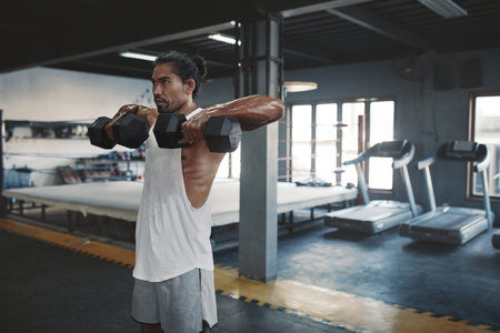 Workout. Man Lifting Dumbbells At Gym. Sexy Sportsman Using Heavy Fitness Equipment For...