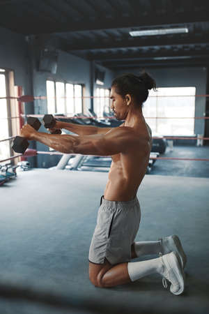 Sport. Man Workout With Dumbbells On Boxing Ring. Handsome Asian Sportsman Training With Fitness Equipment At Gym. Shirtless Sexy Guy Exercising For Strong, Healthy, Muscular Body.の写真素材