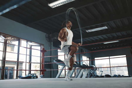 Man On Kettlebell Workout. Sexy Asian Sportsman With Strong, Healthy, Muscular Body Using Heavy Fitness Equipment. Training At Gym For Bodybuilding As Lifestyle.の写真素材
