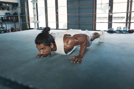Portrait Of Man On Boxing Ring. Sexy Asian Sportsman With Strong, Healthy, Muscular Body At Fitness Center. Boxer With Elastic Tapes On Wrists Having Break After Training At Gym.の写真素材