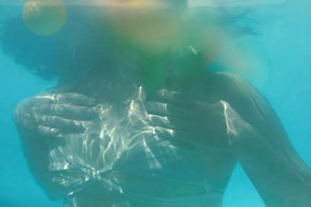 Sexy Model Underwater. Woman With Slim Body In Fashion Swimsuit In Pool. Summer Recreation At SPA Resort.の写真素材