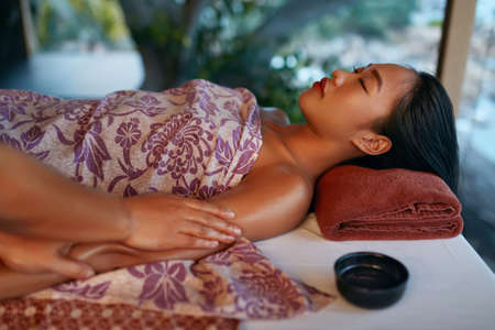 Leg Massage. Closeup Of Massaging Therapy With Oil At Thai Spa. Body Care Procedure At Massage Salon. High Resolutionの写真素材