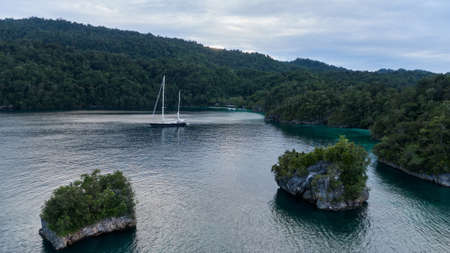 Aerial View Of Triton Bay In Raja Ampat Islands: Lagoon With Turquoise Water And Green Tropical Trees. Wide Angle Nature: Pacific Ocean And Beautiful Landscape In Papua, Indonesia.の写真素材