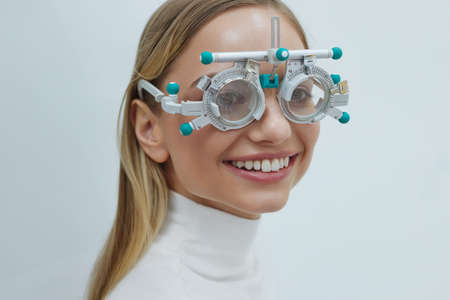 Eyesight Test. Woman In Optometrist Trial Frame At Studioの写真素材