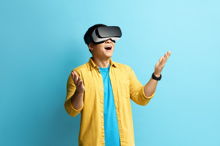 Focused Man Trying VR. Portrait of Amazed Guy Discovering New Technologiesの写真素材