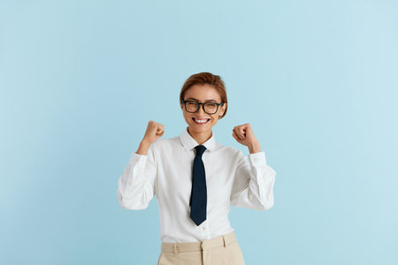 Excited Businesswoman Rejoicing Isolated. Girl Standing with Raised Handsの写真素材