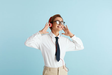 Caucasian Businesswoman Listening Music. Positive Lady Listening Favourite Songの写真素材