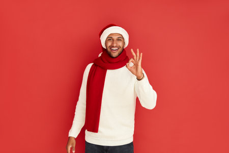 Smiling Man Showing Ok Gesture. Satisfied Guy Making Ok Symbolの写真素材