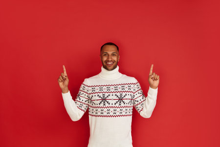 Smiling Man Pointing Hand. Positive Guy Pointing Away Paying Your Attentionの写真素材