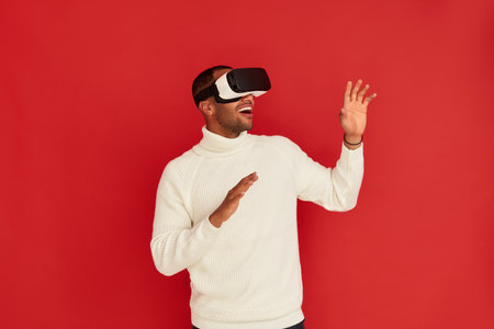 Focused Man Trying VR. Portrait of Amazed Guy Discovering New Technologiesの写真素材